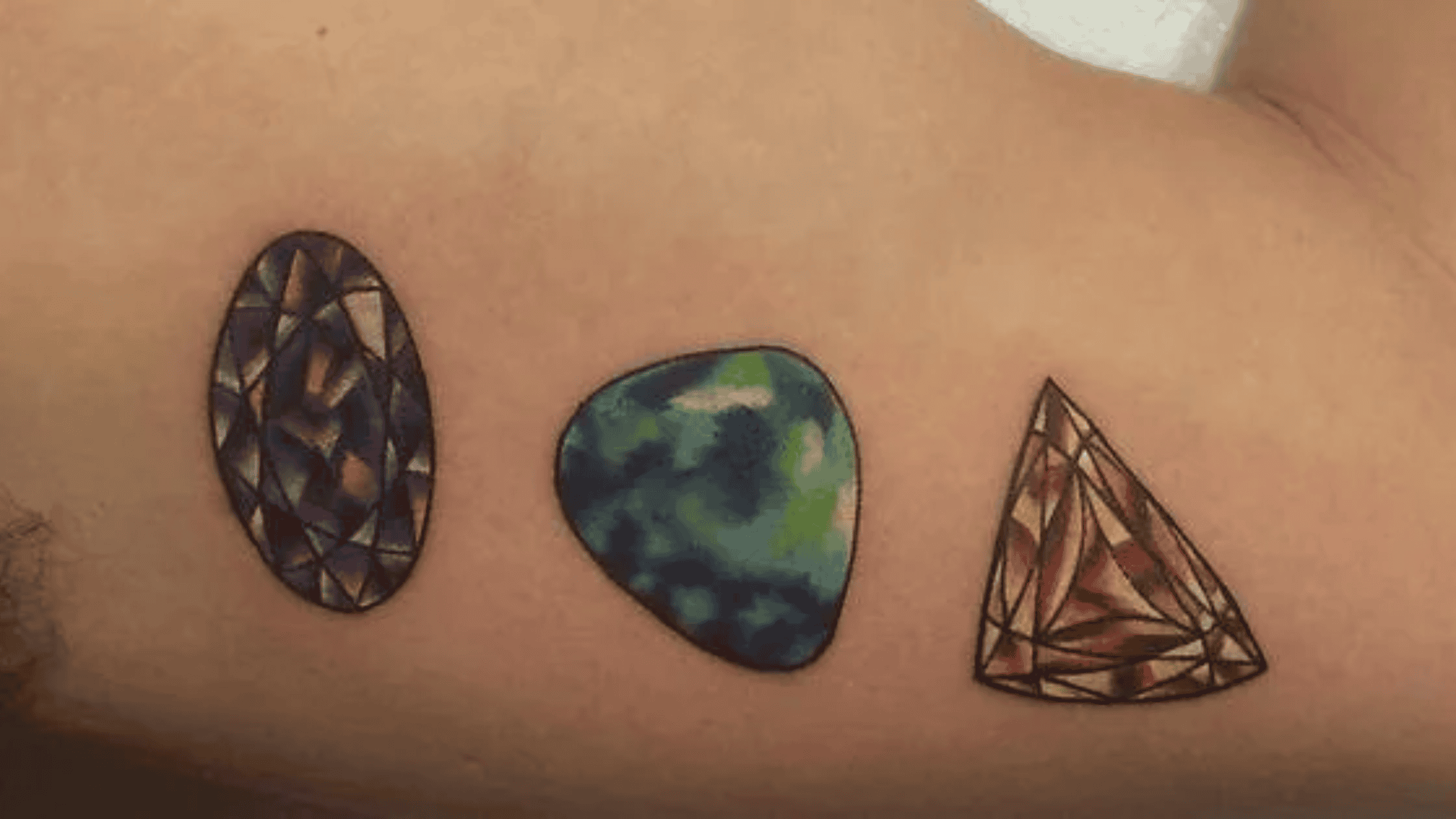 Birthstone Tattoos: Ink the Birthstone Color or a Representation of the Gem